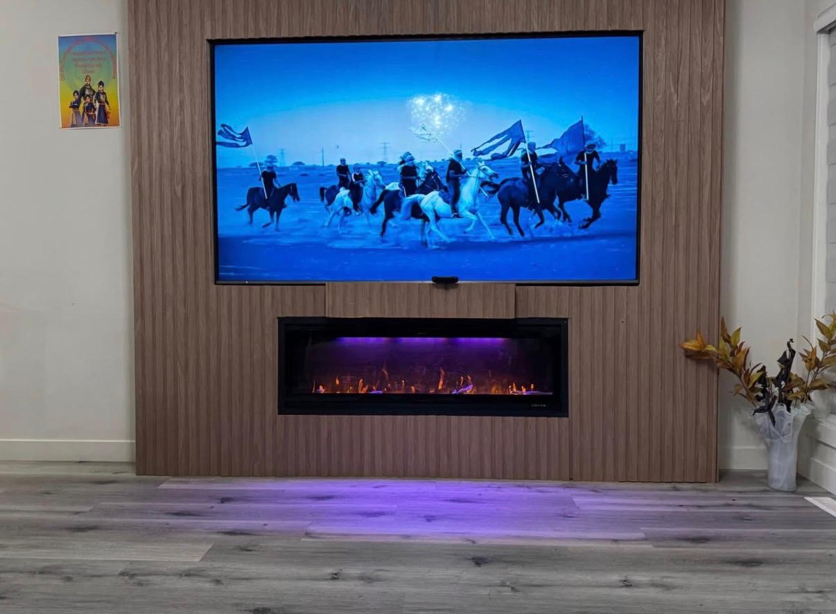 TV wall mount installation by Devam Construction